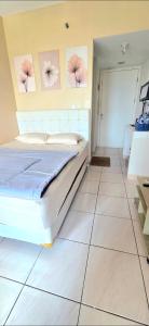 Ένα ή περισσότερα κρεβάτια σε δωμάτιο στο summarecon springlake view