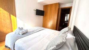 Postel nebo postele na pokoji v ubytování Acogedor apartamento by Prestigi + 2 fotografie