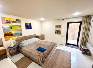 Ένα ή περισσότερα κρεβάτια σε δωμάτιο στο DavOs studios