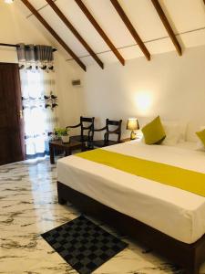 Postel nebo postele na pokoji v ubytování Middle of The Village Sigiriya