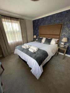 Ένα ή περισσότερα κρεβάτια σε δωμάτιο στο Y Seren Hotel