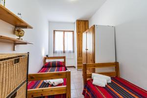 Ένα ή περισσότερα κρεβάτια σε δωμάτιο στο Algherocoralapartment