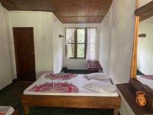 Ένα ή περισσότερα κρεβάτια σε δωμάτιο στο Handunkanda Nature Escape +15 φωτογραφίες