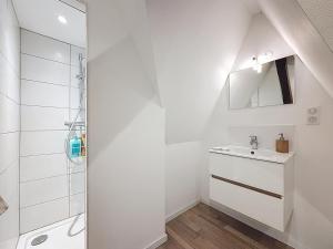 a white bathroom with a sink and a shower at Le Toit Sahler-Château Sahler XXᵉ in Exincourt +18 photos
