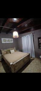 Ένα ή περισσότερα κρεβάτια σε δωμάτιο στο Casa Calamuchita