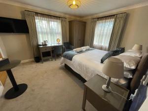 Ένα ή περισσότερα κρεβάτια σε δωμάτιο στο Y Seren Hotel