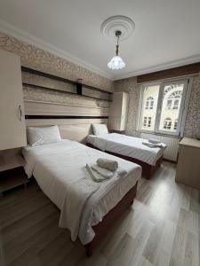 Ένα ή περισσότερα κρεβάτια σε δωμάτιο στο Balkan Palace Edirne +95 φωτογραφίες