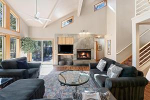 a living room with a couch and a fireplace at 1 Colonial in Sunriver