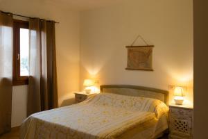 Postel nebo postele na pokoji v ubytování Tamarici