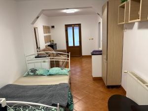 Ένα ή περισσότερα κρεβάτια σε δωμάτιο στο Matteo Ivan Imob