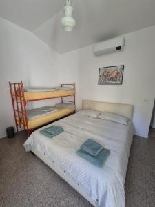 En eller flere senge i et værelse på Villetta Marina