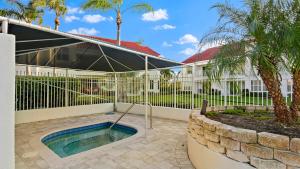 a house with a swimming pool and a fence at St Pete Vista Verde East 3 223 Spectacular Unit in Point Brittany
