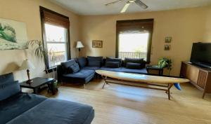 a living room with a couch and a table at Heartbreak 30 day minimum in Hood River