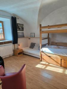 En eller flere senge i et værelse på Appartement face aux pistes - Serre Chevalier Briançon