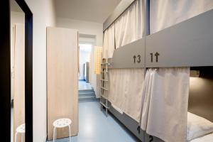 Postel nebo postele na pokoji v ubytování Maverick Athenaeum