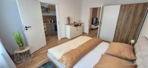 Una cama o camas en una habitación de Enjoy Liptov