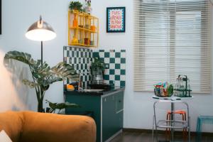 a kitchen with a couch and a table in a room at KINARI space Gleam in Hue