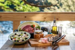 a table with a plate of food and a bowl of food at AfriCamps at Bonamanzi Game Reserve in Hluhluwe