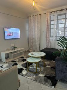 TV a/nebo společenská místnost v ubytování One bedroom in Amaziah, Muthiga