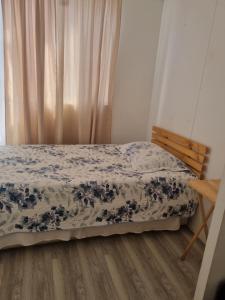 a bedroom with a bed and a wooden floor at Departamento elsa ramitez in Ovalle