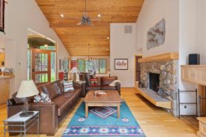 a living room with a couch and a fireplace at Glaze Meadow 376 in Black Butte Ranch