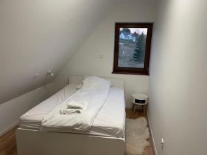 Postel nebo postele na pokoji v ubytování Domek Rodzinny Martynka