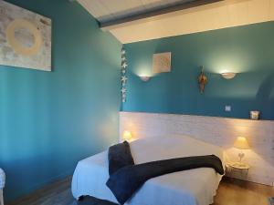 Postel nebo postele na pokoji v ubytování Villa de l'Olivier