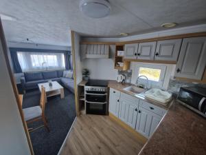 Kuchyň nebo kuchyňský kout v ubytování Chatka pod Tatrami + 12 fotografií