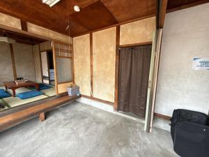 Voodi või voodid majutusasutuse Kuwana Inn Kyomachi Nagashimaspa Land, Kasuga Taisha, Kuwana Station close to old private house toas