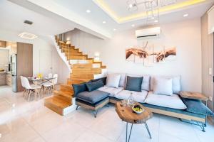 a living room with a couch and a table at Perla Nera Villa Mit Privatem Beheiztem Pool in Kávallos +26 photos