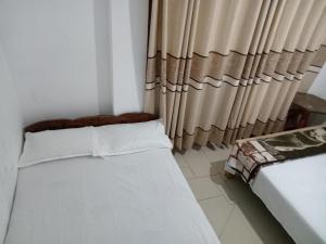 Postel nebo postele na pokoji v ubytování Diyatalawa Mountain Holiday Resorts