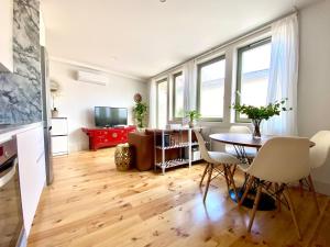 a living room with a table and a couch at VIVA - Rooftop Terrace View Flat in Porto