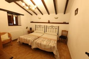 Ένα ή περισσότερα κρεβάτια σε δωμάτιο στο Casa Caborzal