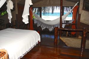 En eller flere senge i et værelse på Shangri-lá Pousada na praia em Itacaré