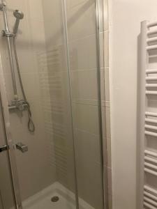 a bathroom with a shower with a glass door at L'observatoire in Le Havre