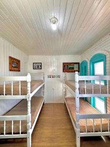 Ένα ή περισσότερα κρεβάτια σε δωμάτιο στο Casa do Rogério Hostel