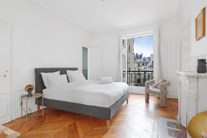 Ένα ή περισσότερα κρεβάτια σε δωμάτιο στο Le Marais élégant