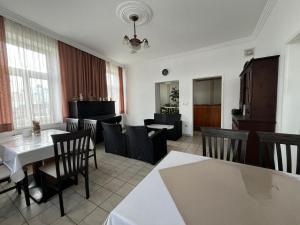 a dining room with a table and chairs at Mariazellerhof Room 011 in Sankt Pölten