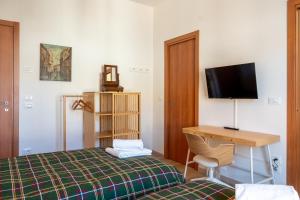 Postel nebo postele na pokoji v ubytování Dimore di Sant'Albino Montepulciano