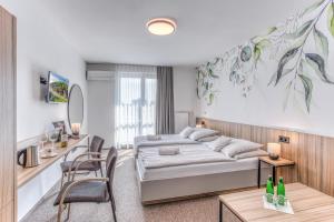 Ένα ή περισσότερα κρεβάτια σε δωμάτιο στο STEELHOUSE Hotel +56 φωτογραφίες