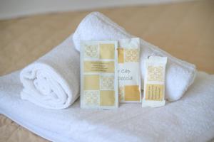 a set of three products sitting on top of a towel at Grand Meeting Hotel in Rimini