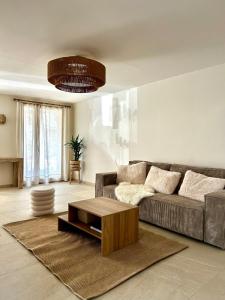 Χώρος καθιστικού στο Appartement La Vieille Maison Le joyau rénové