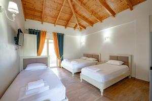 Giường trong phòng chung tại Villa Bukuroshi