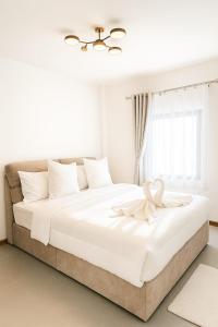 Postel nebo postele na pokoji v ubytování Wasana Village Phutoei