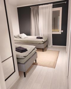 Ένα ή περισσότερα κρεβάτια σε δωμάτιο στο Villa Kauliranta - cozy home in Lapland