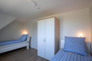 Ένα ή περισσότερα κρεβάτια σε δωμάτιο στο Ferienhaus Koch