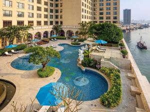 an aerial view of a pool in a hotel at Sofitel Macau At Ponte 16 in Macau
