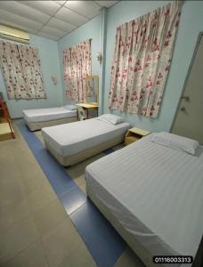 Postel nebo postele na pokoji v ubytování Stay Inn Kota Bharu + 5 fotografií