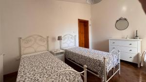 Ένα ή περισσότερα κρεβάτια σε δωμάτιο στο Casa Marisa Villa Vacanza