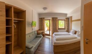 Voodi või voodid majutusasutuse Gasthof Stimmersee toas